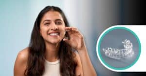 A smiling woman with long brown hair holds up a clear dental aligner. To the right, a smaller circular image shows a close-up of a pair of clear aligners.