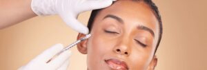 Close-up of professional administering Botox injection to reduce facial wrinkles and fine lines